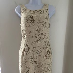 cream colored dress with gold flower designs